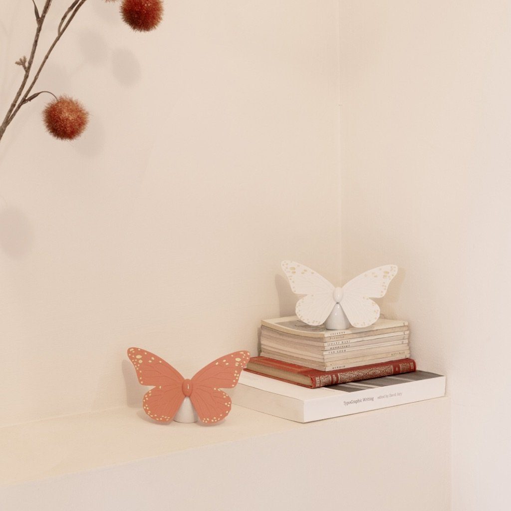 Exquisite Lladro Porcelain Butterfly Figurine with Golden Luster and Coral Hues