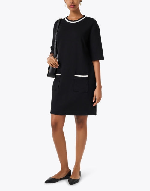 Marc Cain Sport's Stylish Black Knit Dress with Contrasting White Trim and Pockets