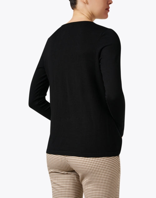 Stylish Black Knit Top with Decorative Button Cuffs