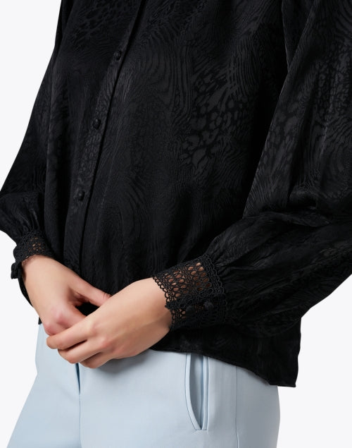 Elegant Black Printed Women's Blouse with Unique Design
