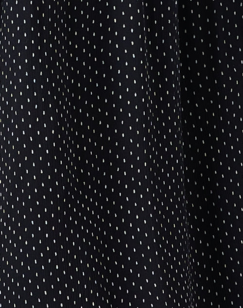 Elegant Black Dress with Polka Dots and Chic Details