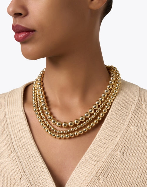 Stunning Gold Three-Strand Beaded Necklace for Fashion Elevation