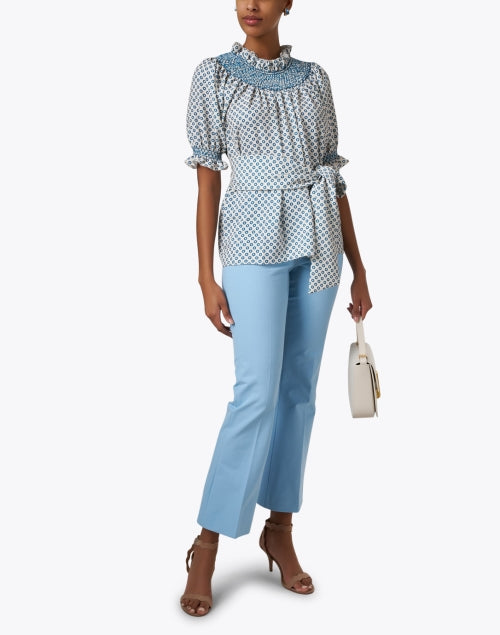 Charming Maria Blue Dotted Self - Tie Ruffle Neck Blouse
