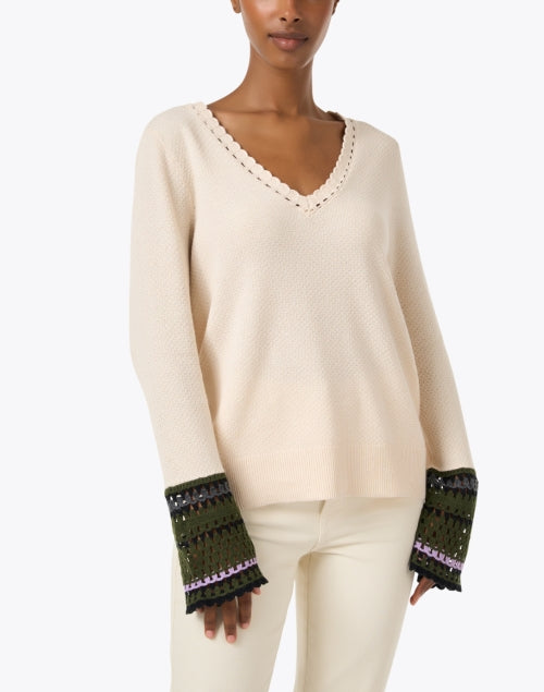 Cream-colored Knit Sweater with Playful Crocheted Cuff Links