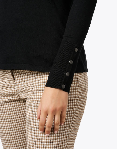 Stylish Black Knit Top with Decorative Button Cuffs