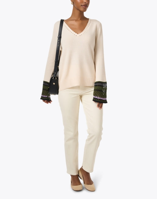 Cream-colored Knit Sweater with Playful Crocheted Cuff Links