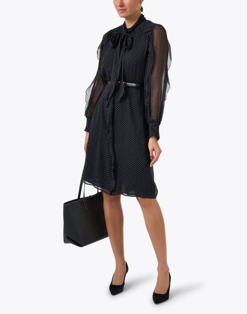 Elegant Black Dress with Polka Dots and Chic Details