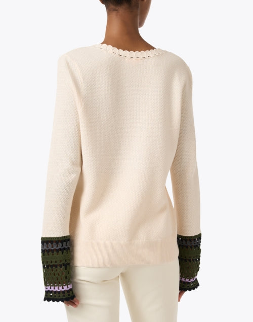 Cream-colored Knit Sweater with Playful Crocheted Cuff Links