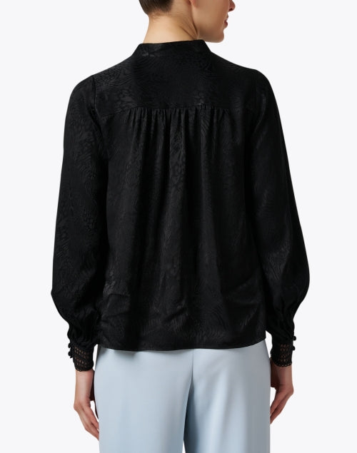 Elegant Black Printed Women's Blouse with Unique Design