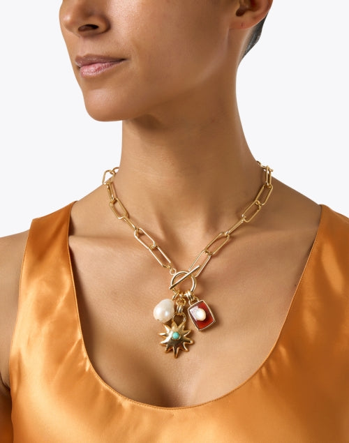 Lizzie Fortunato's Stunning Gold-Plated Helios Charm Necklace for Fashion Statements