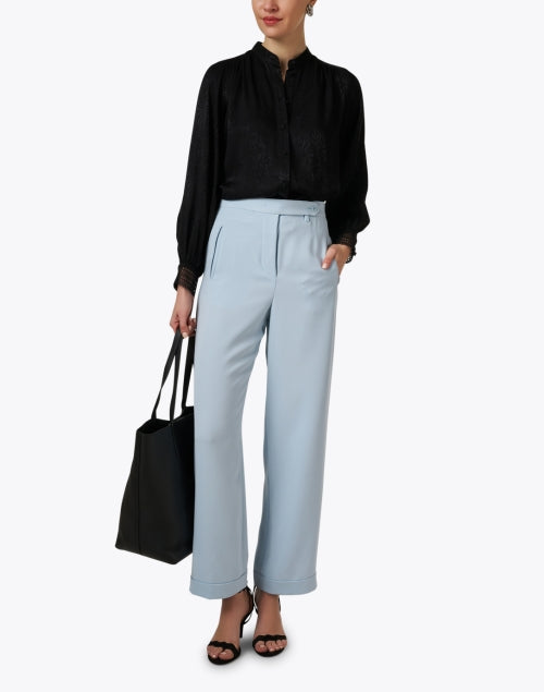 Elegant Black Printed Women's Blouse with Unique Design